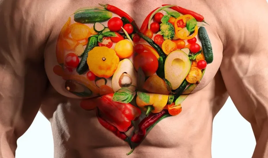 Un torse d'homme musclé avec des légumes illustrés dessus. L'homme fait du sport en étant végétarien.
